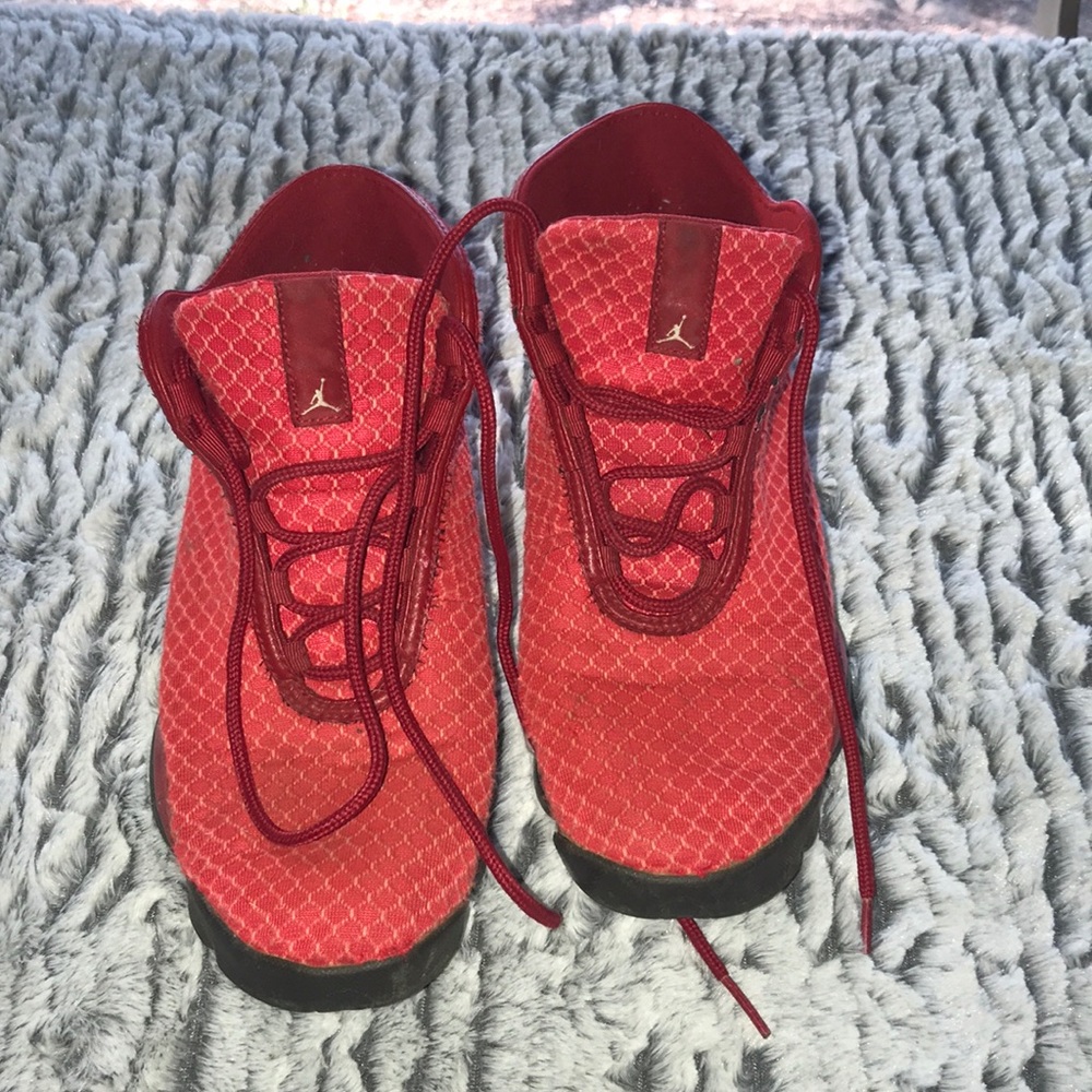 Red Jordan tennis shoes